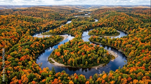 Tableau sur toile Aerial view of meandering river bends in colorful autumn forest