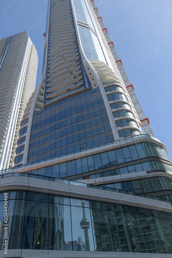 Fototapeta premium SkyTower at Pinnacle One Yonge designed by Hariri Pontarini Architects, Toronto (with reflection of CN Tower, at bottom)