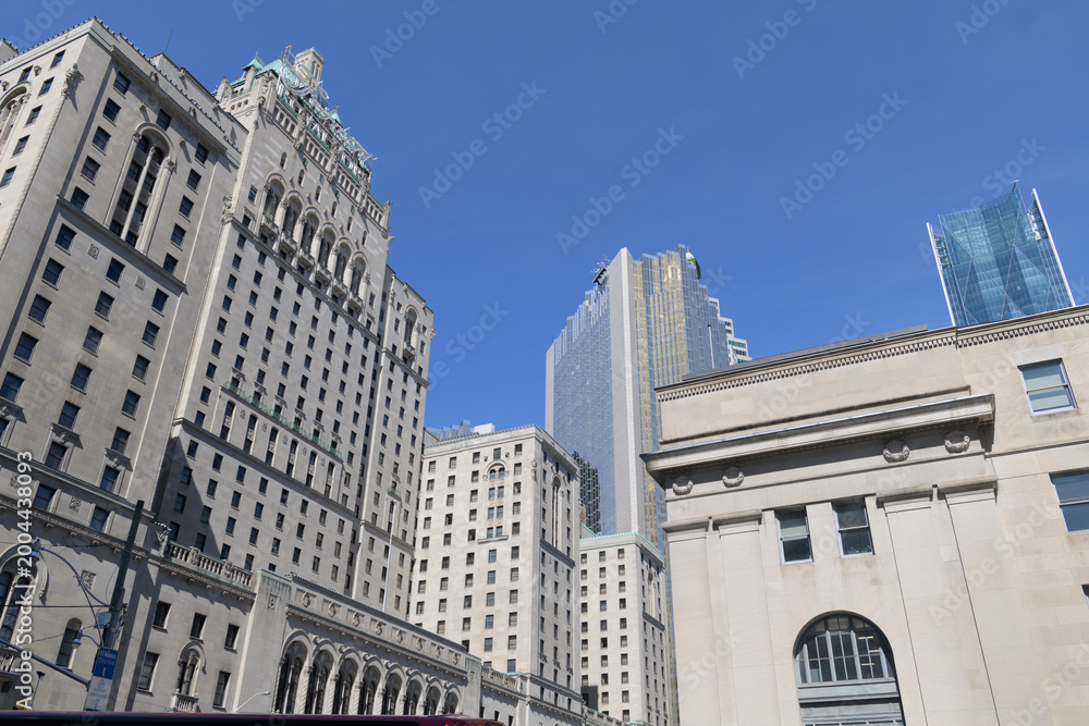Fototapeta premium view of Fairmont Royal York hotel, Royal Bank Plaza, and a section of Union Station, seen from York St, Toronto