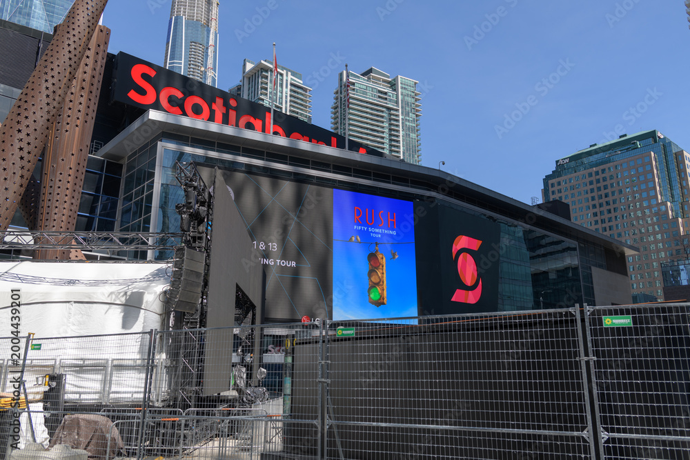 Fototapeta premium Maple Leaf Square / Jurassic Park - Scotiabank Arena LED sign (featuring concert promotion for RUSH), Toronto