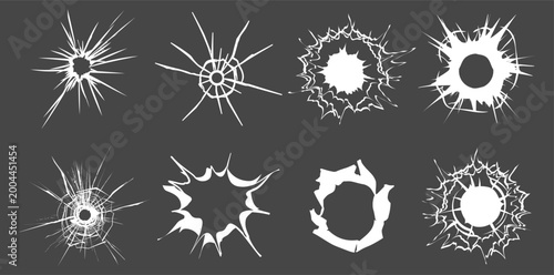 Fotografie Bullet hole impact on broken shattered glass texture on transparent background