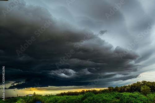 Ominous Storm Front Rolling Over Lush Greenery