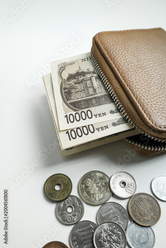 Japanese Yen Coins and Cash with Leather Wallet on White Background, Lifestyle personal finance, saving money, budgeting, and financial management