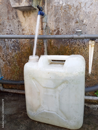 Filling Water into Plastic Jerrycan from Outdoor 