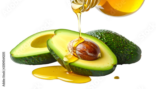 Golden oil pours over sliced avocados against a black backdrop, close-up shot