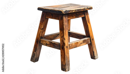 A weathered, square wooden stool on a black background. It appears old and well-used