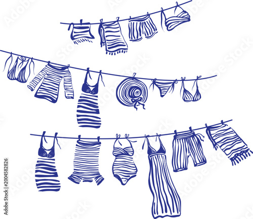 Slika na platnu Clothes hanging on rope including striped dress swimsuit underwear shirt and hat