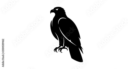 Foto A powerful black silhouette of an eagle perched regally, with sharp claws and keen eyes, on a white background