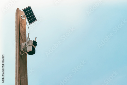 Solar-powered outdoor CCTV camera mounted on a pole