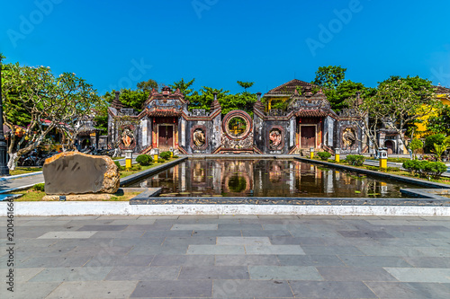 Fotografie A view of a Temple Gate in the old town in Hoi An, Vietnam on a bright sunny day