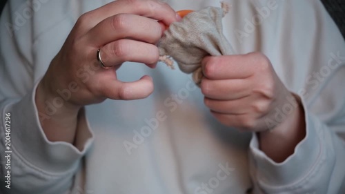 Woman holding reusable menstrual cup promoting sustainable hygiene product