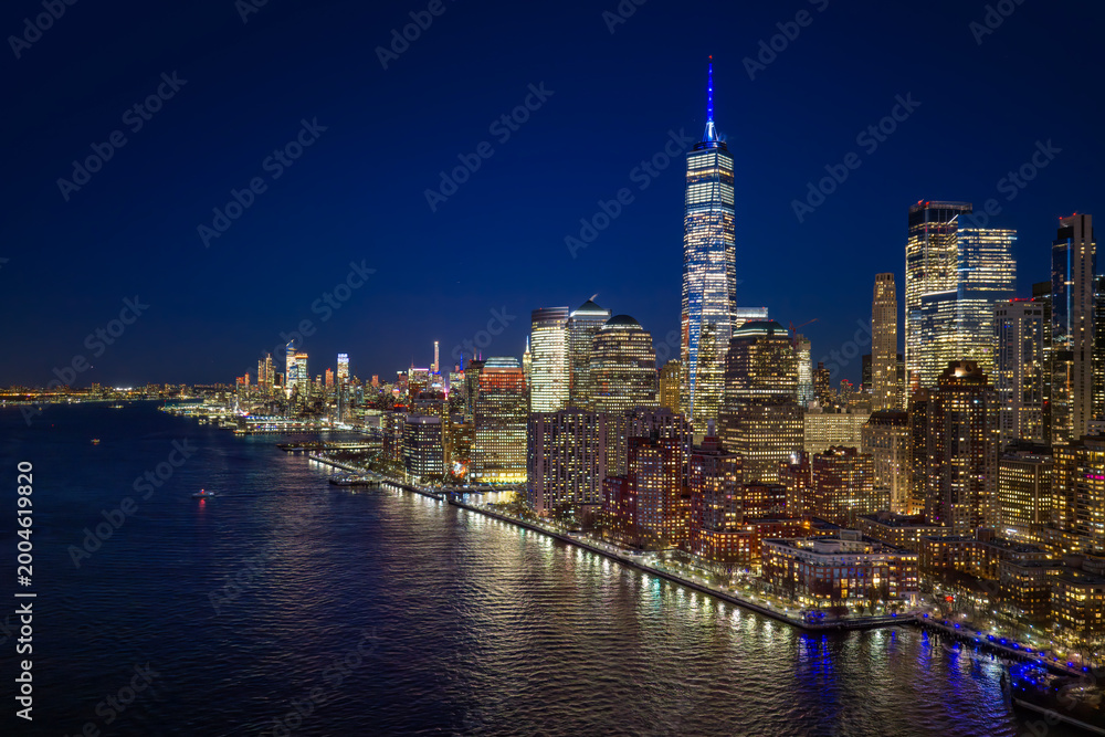 Obraz premium New York night skyline view. NYC metropolis aerial view at night. New York City panoramic night view of Manhattan. New York skyline at night. NYC skyline view.
