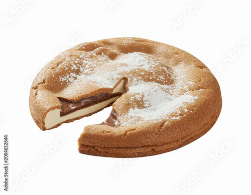 A round chocolate filled cookie with a slice cut out showing the creamy filling and powdered sugar