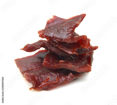 Beef jerky pieces on white background