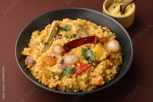 Traditional Tamil Nadu Sambar rice with mixed vegetables, dal, rice, and served with ghee