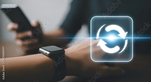 Closeup of a person wearing a smartwatch and holding a smartphone with a digital refresh icon overlay, symbolizing synchronization and connectivity in the digital age