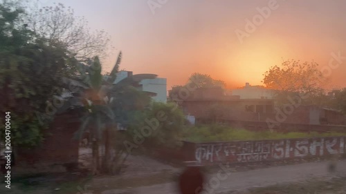 Rural India as seen from a train during sunset. This is taken from the night train from Varanasi to Agra.