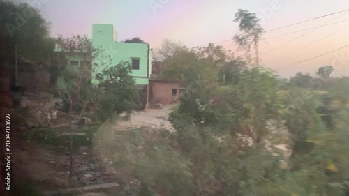 Rural India as seen from a train during sunset. This is taken from the night train from Varanasi to Agra.