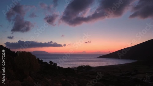 Beautiful view of a colourful sunrise at the Theodoti beach in Ios Greece