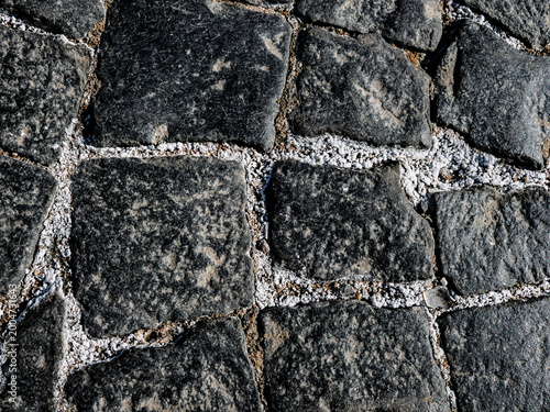 Weathered cobblestone pavement texture background