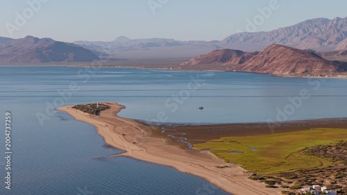 Aerial views capture sunrise over Bahia De Los Angeles, highlighting beaches and camping spots in Baja California Mexico.