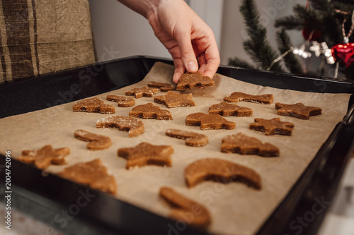 closeup of woman preparing homemade cookies for christmas