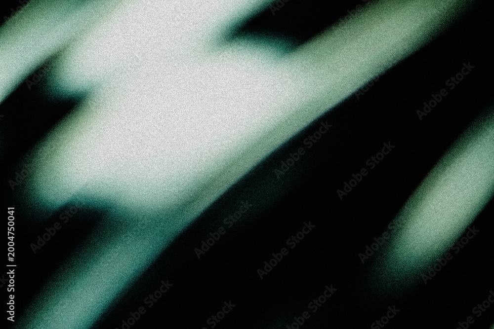 Obraz premium Blurred bright teal and white diagonal light streaks crossing dark grainy background