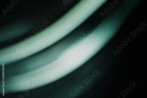 Abstract flowing light waves in soft green and white with dark noisy backdrop