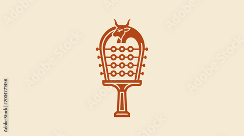 Fotografie Traditional African Idiophone Percussion Instrument with Beaded Elements and Animal Motif on Bright Background