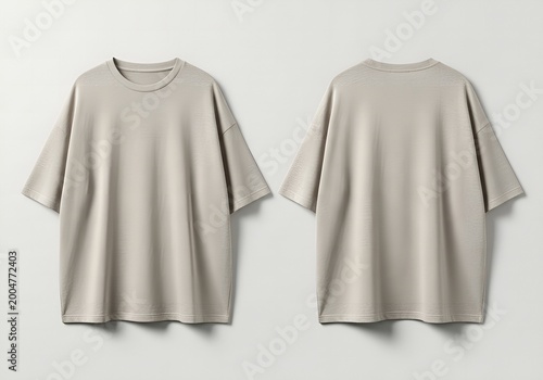 A cotton tee shirt in a neutral beige color presents a versatile apparel choice, featuring a relaxed fit perfect for casual fashion styling, offering both comfort and a timeless aesthetic