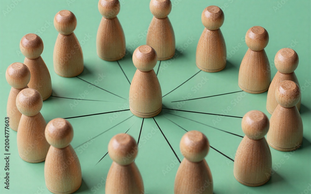 Obraz premium Wooden figures form a circle connected by lines to one central figure.