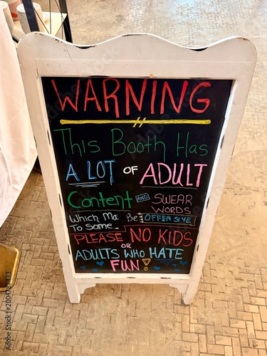 blackboard sign outside of shop at flea market