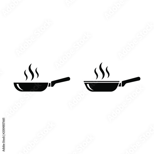 Fotografia Two frying pans with steam rising are cooking food on stovetop