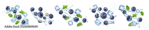 Panel kuchenny z motywem Fresh blueberries and water splashes in air on white background, set