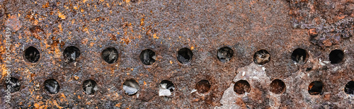 Foto Texture old weathered worn messy obsolete dirty barbecue rust round brown holes