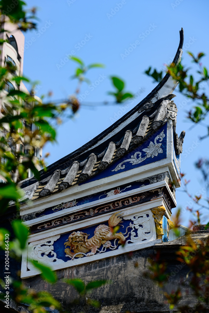 Fototapeta premium A detailed view of a late Qing dynasty classical garden building in Fuzhou, featuring intricate wooden carvings, curved eaves, and traditional landscape design.