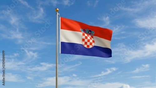 The Croatia flag flies against a bright blue sky.