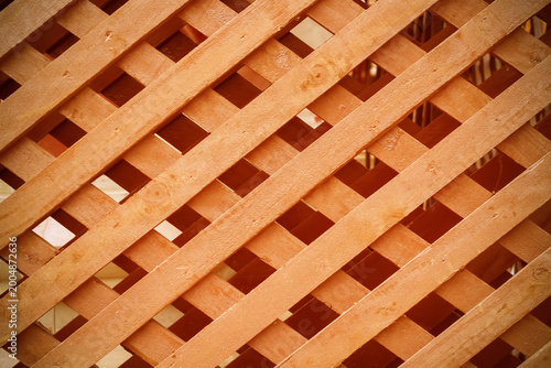 Billede på lærred Brown wood fence interlace patterns