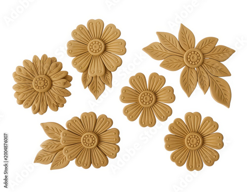 A collection of decorative wooden flower ornaments with leaf details isolated on white background