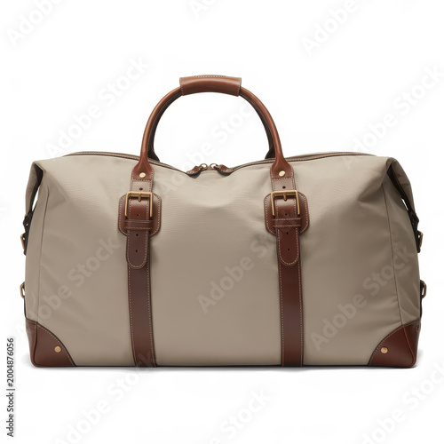 A large travel duffel bag made of beige fabric with brown leather straps and metal buckles