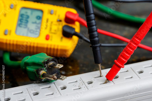 Multimeter Testing Damaged Electrical Cord