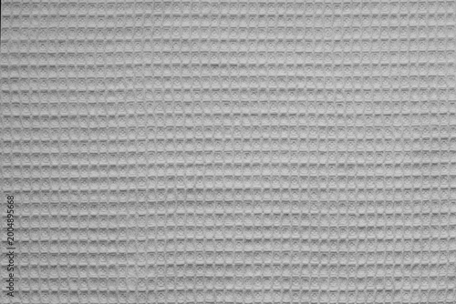 Texture of white clean beige waffle towel. Background image of kitchen towel surface
