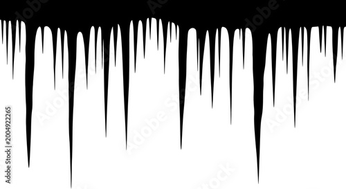 Tableau sur toile Sharp glistening icicles hang precariously from an unseen ledge against a stark