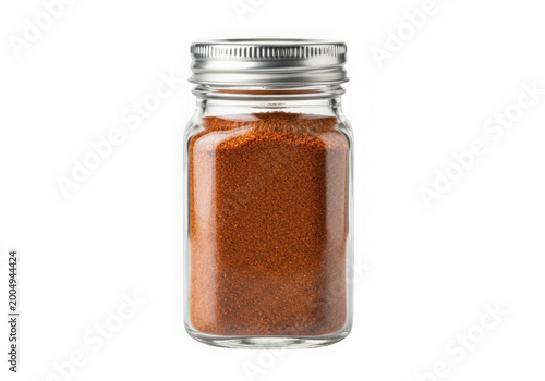 Glass spice jar filled with ground cinnamon isolated on transparent background