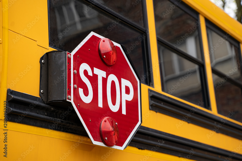 Photography Poster Close up of school bus stop sign with flashing