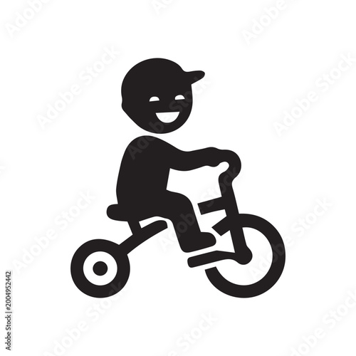 Happy little boy riding a tricycle icon silhouette on white background