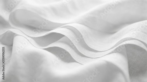 white silk fabric, soft textile folds, elegant linen texture, smooth cotton cloth, white satin surface, wavy material detail, minimalist fabric background, clean white sheet, delicate cloth waves