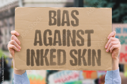 Valokuva "Bias Against Inked Skin" research confirms tattoo bias measurably persisting in adult modern daily contexts