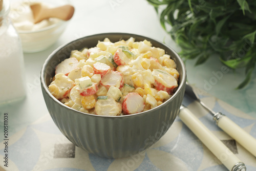 A bowl with traditional crab salad	