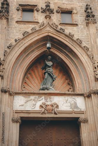 Photography Gothic facade detail of an ancient church in Barcelona, Spain